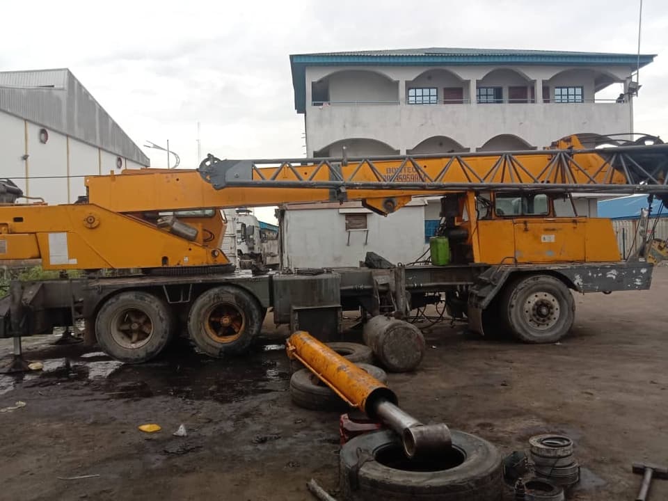 Truck crane cylinder removed for repair